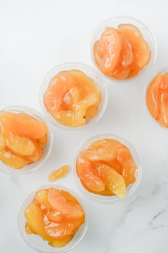 Apple Pie In A Cup - Cultivating Brilliant Minds clear cups with graham cracker crumble and apple pie filling for these back to school snacks