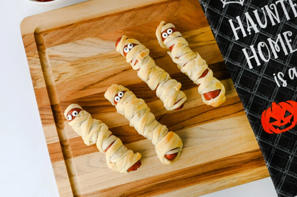 Mummy Hot Dogs - Cultivating Brilliant Minds hot dogs wrapped with strips of crescent rolls to look like mummies