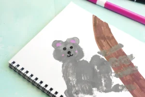 a Letter K Handprint Craft that is decorated to look like a koala with the words "K is for koala"