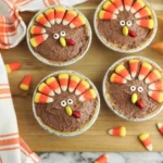 mini turkey pies made with chocolate pudding and decorated to look like turkeys