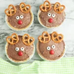 mini rudolph pies that are chocolate pudding pies decorated to look like rudolph