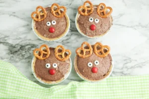 mini rudolph pies that are chocolate pudding pies decorated to look like rudolph