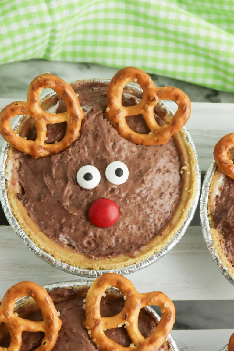 mini rudolph pies that are chocolate pudding pies decorated to look like rudolph