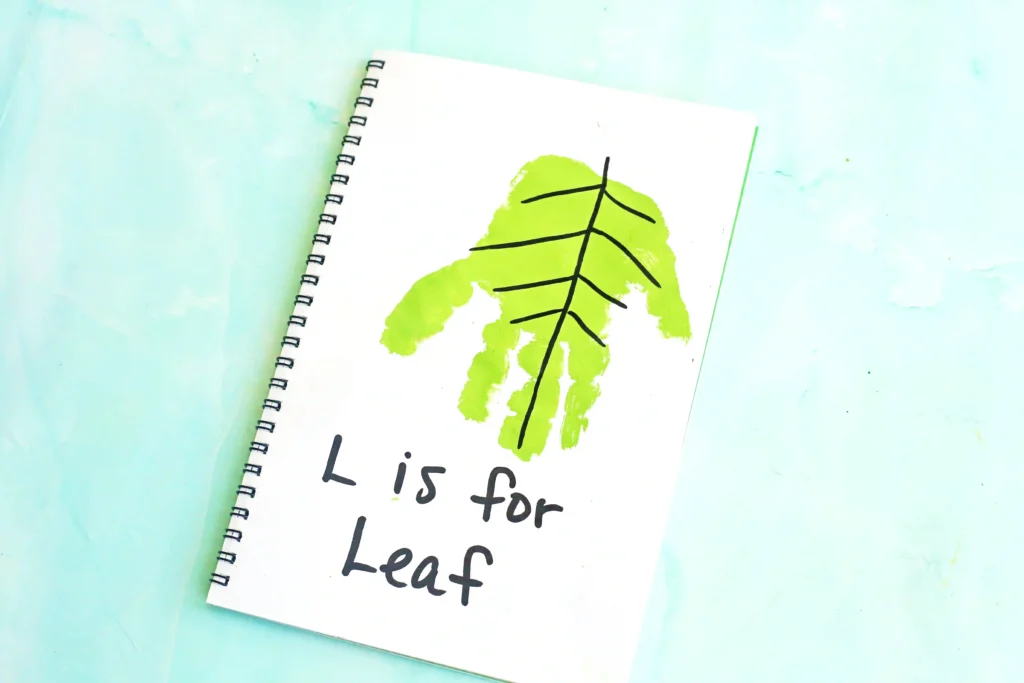 Letter L Leaf Handprint Craft - Cultivating Brilliant Minds a letter L handprint craft that is a green handprint decorated to look like a leaf