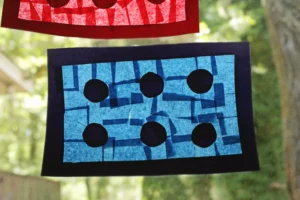 LEGO Brick Suncatcher made of tissue paper and contact paper hung in a window