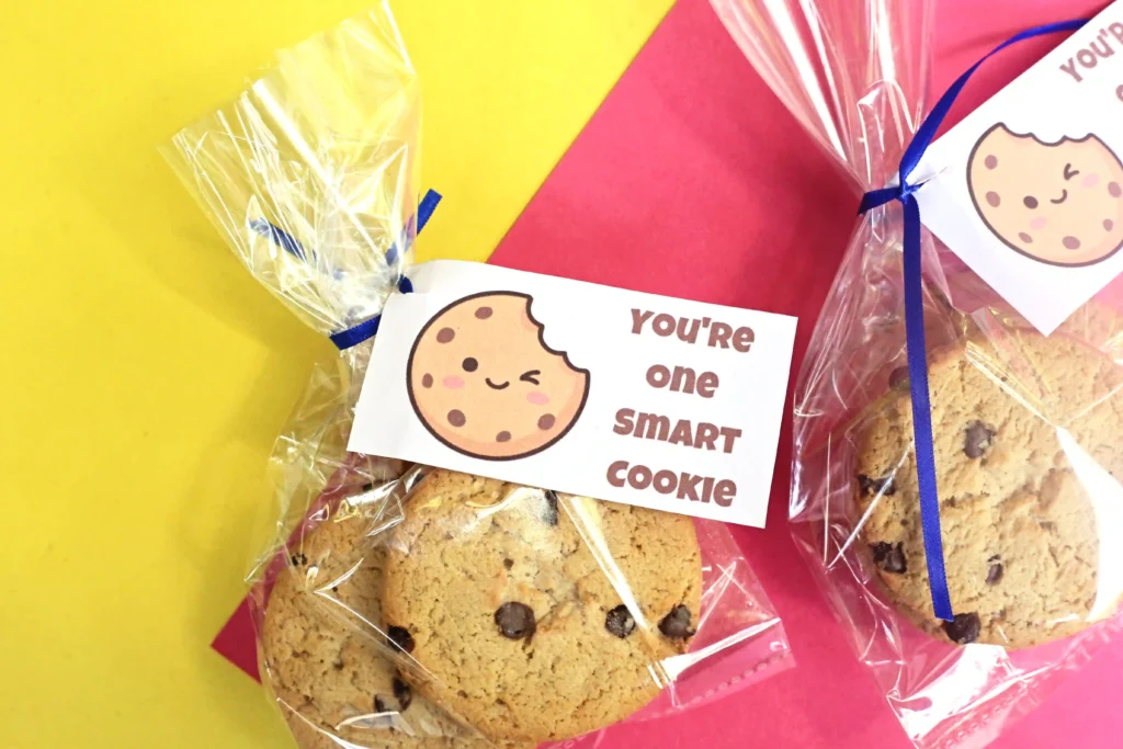 back to school printable tags that read "you're one smart cookie" with a bag with cookies on a yellow and red background 