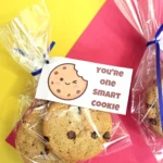 back to school printable tags that read "you're one smart cookie" with a bag with cookies on a yellow and red background