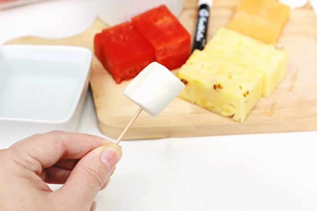 a toothpick with a marshmallow on it
