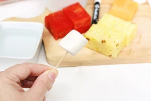 a toothpick with a marshmallow on it