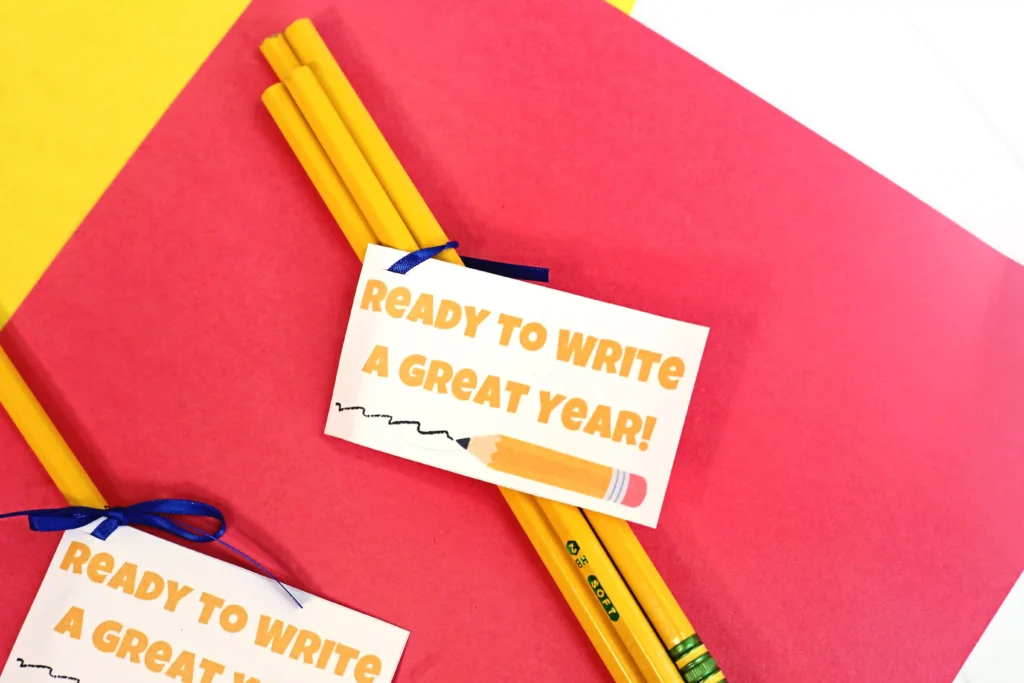 back to school printable student gift tags that are pencils with a gift tag that reads "ready to write a great year" on a red and yellow background