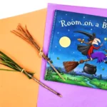 a broomstick nature craft that is a broomstick made out of pine needles, sticks, and twine to accompany the book "Room on the Broom"