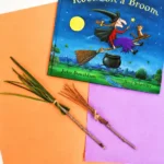 Cover of the children's book 'Room on the Broom' featuring a witch riding a broom with a cauldron and a cat against a starry night sky and moon.