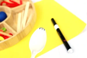 a plastic spoon with black marks on top to make it look like a spork