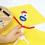 a toy story forky playdough tray that uses a plastic fork and playdough to create forky