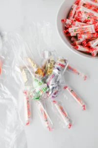a clear plastic glove filled with halloween candy