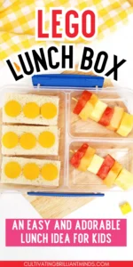 Top-down view of a clear lunchbox on a wooden board, with cheese-topped sandwiches and fruit-skewers, plus bold LEGO LUNCH BOX text overlay and a pink caption for kids.