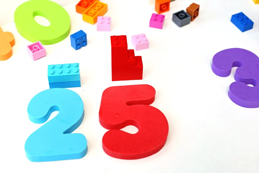 lego math towers with foam numbers 2 and 5 and the same amount of lego blocks