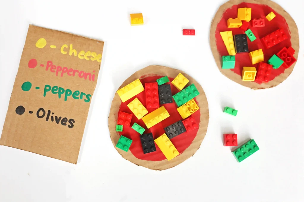 a LEGO Pizza Activity made out of cardboard and legos