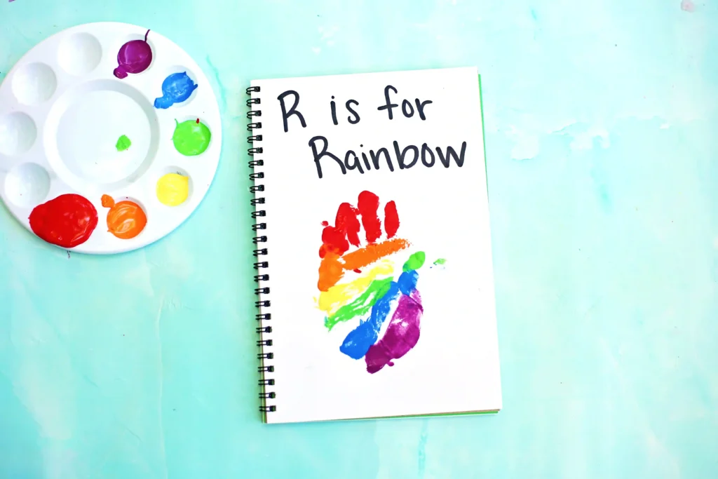a Letter R Handprint Craft that reads "r is for rainbow"