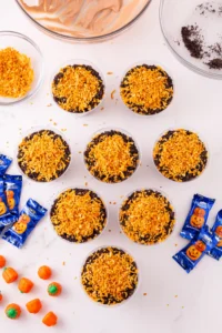 dirt cups with crushed oreos and toasted coconut on top