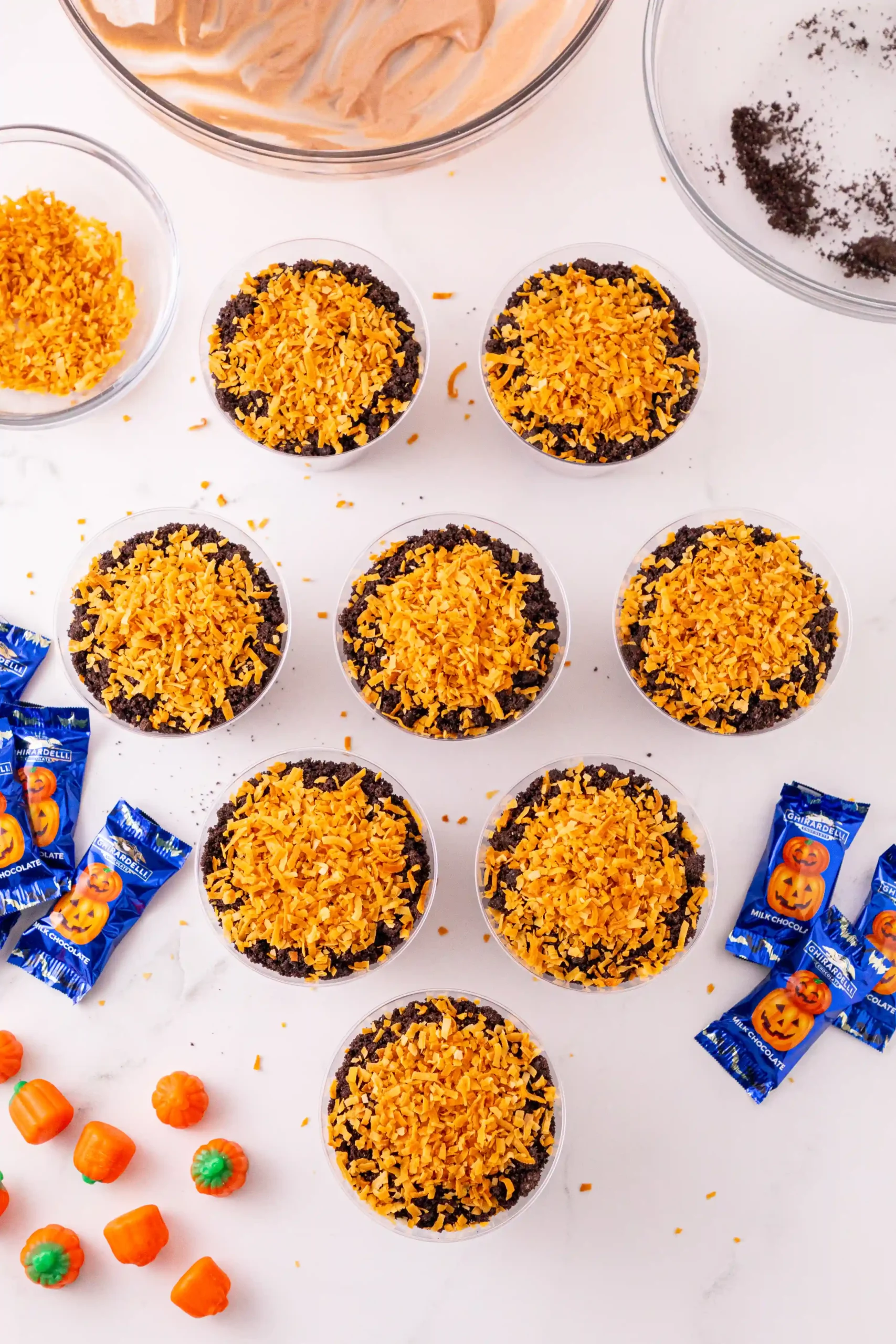 dirt cups with crushed oreos and toasted coconut on top