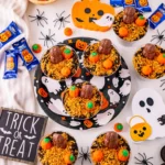 Pumpkin Patch Dirt Cups that have a chocolate pumpkin and candy pumpkins on top