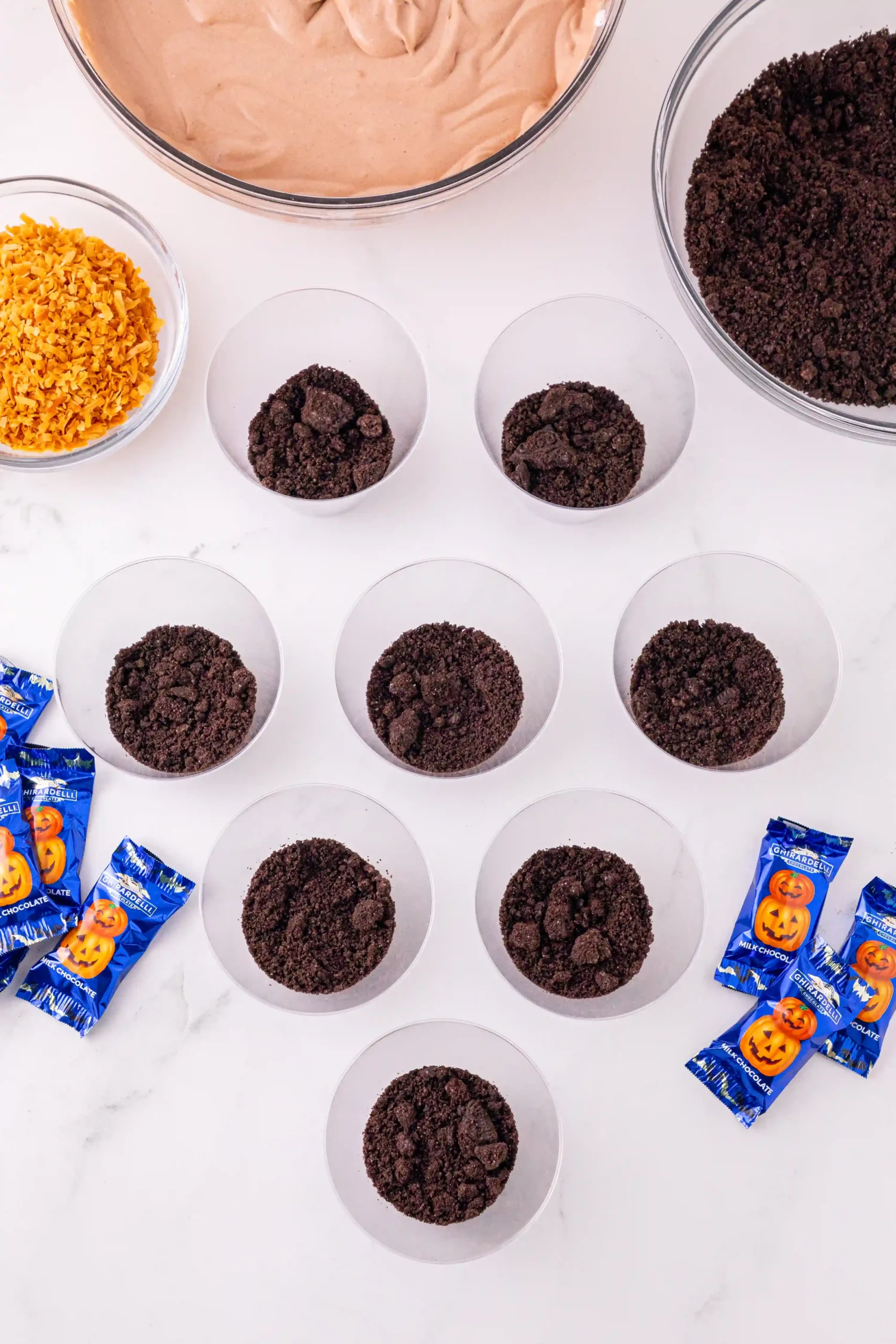 plastic cups with crushed oreos inside