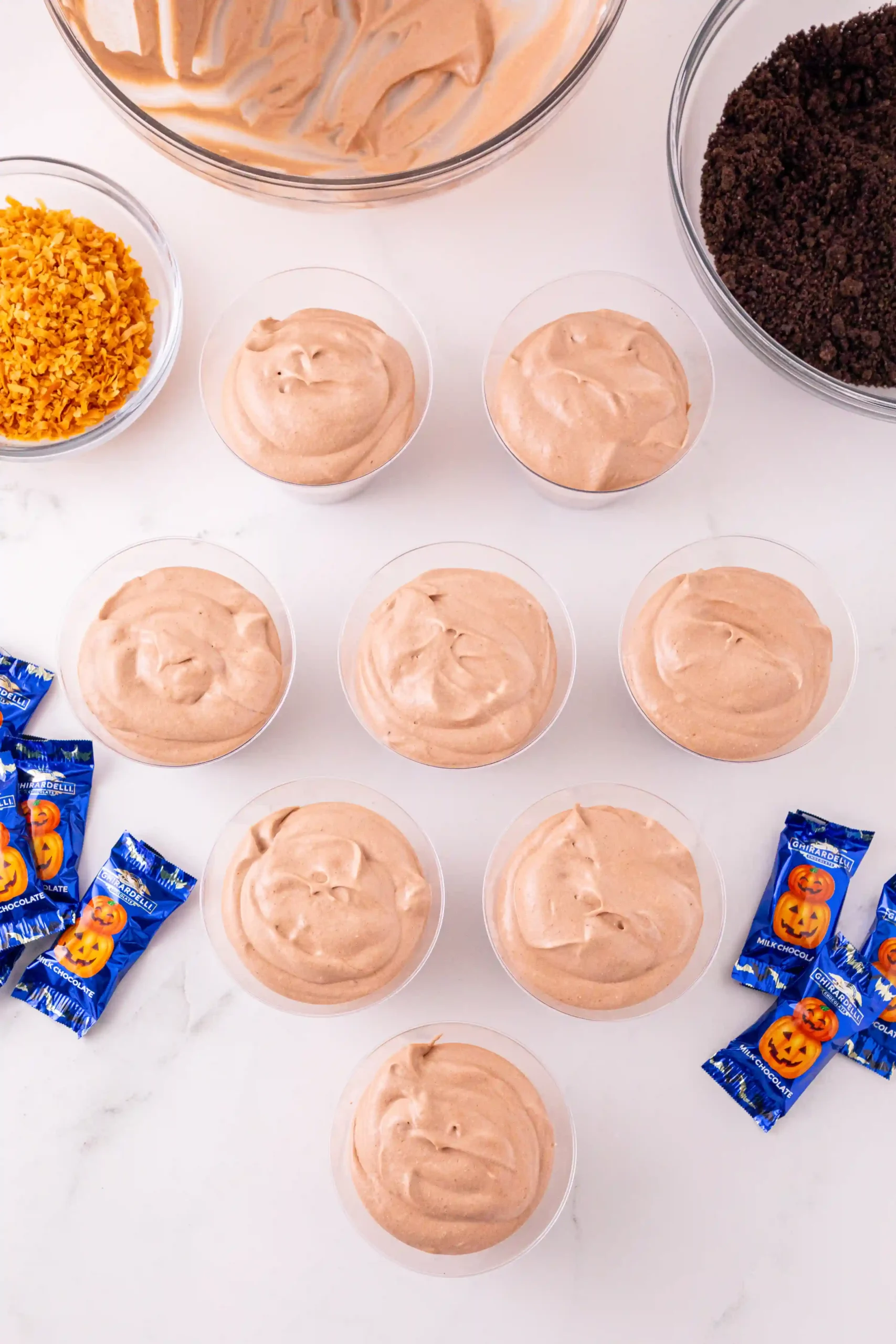 plastic cups with pudding mix inside