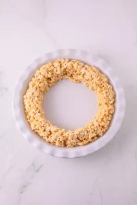 Ring-shaped crispy rice cereal treat on a white plate