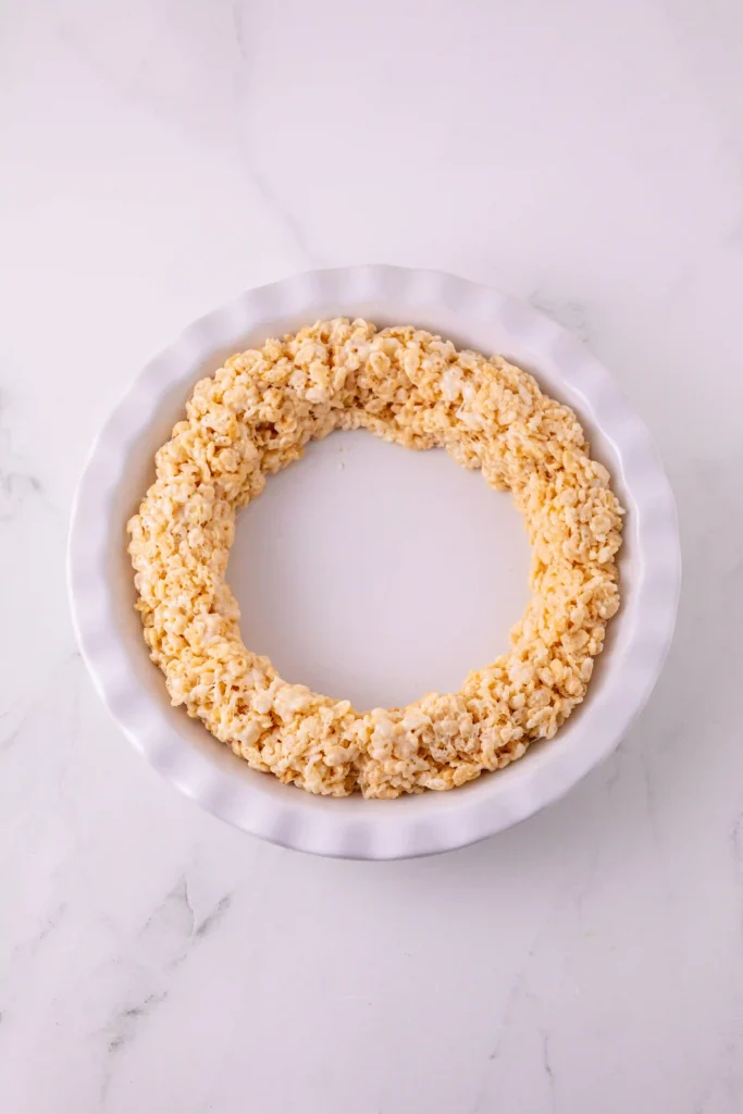 Ring-shaped crispy rice cereal treat on a white plate