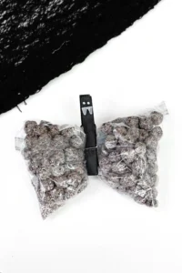 snack bags filled with chocolate cereal with a clothespin to look like a bat