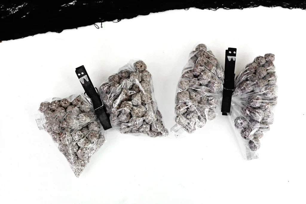 Bat Snack Bags - Cultivating Brilliant Minds snack bags filled with chocolate cereal with a clothespin to look like a bat