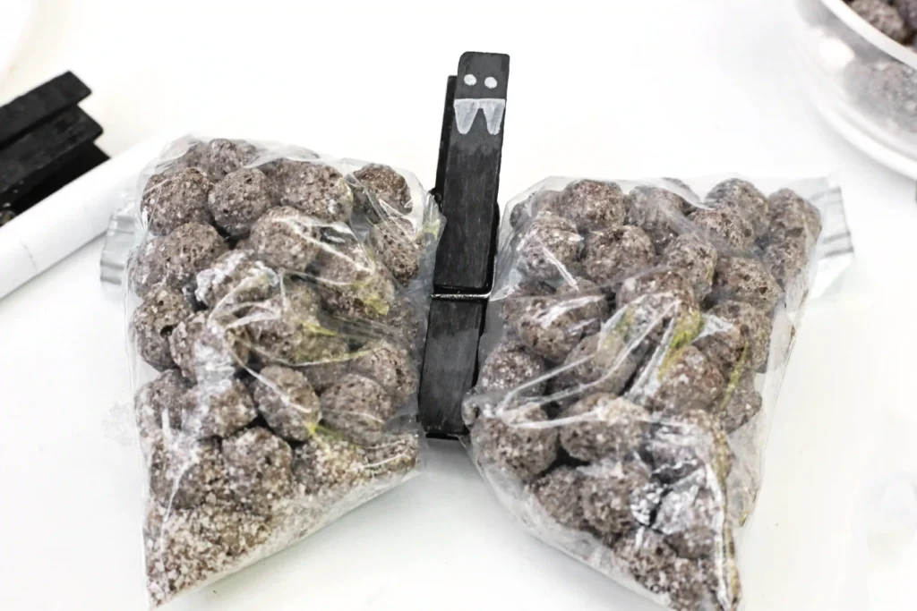 Bat Snack Bags - Cultivating Brilliant Minds snack bags filled with chocolate cereal with a clothespin to look like a bat