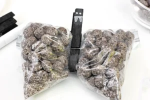 snack bags filled with chocolate cereal with a clothespin to look like a bat