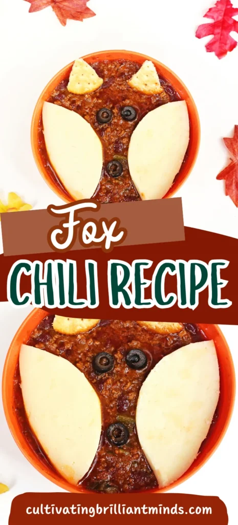 a bowl of chili with crackers and olives on top to look like a fox