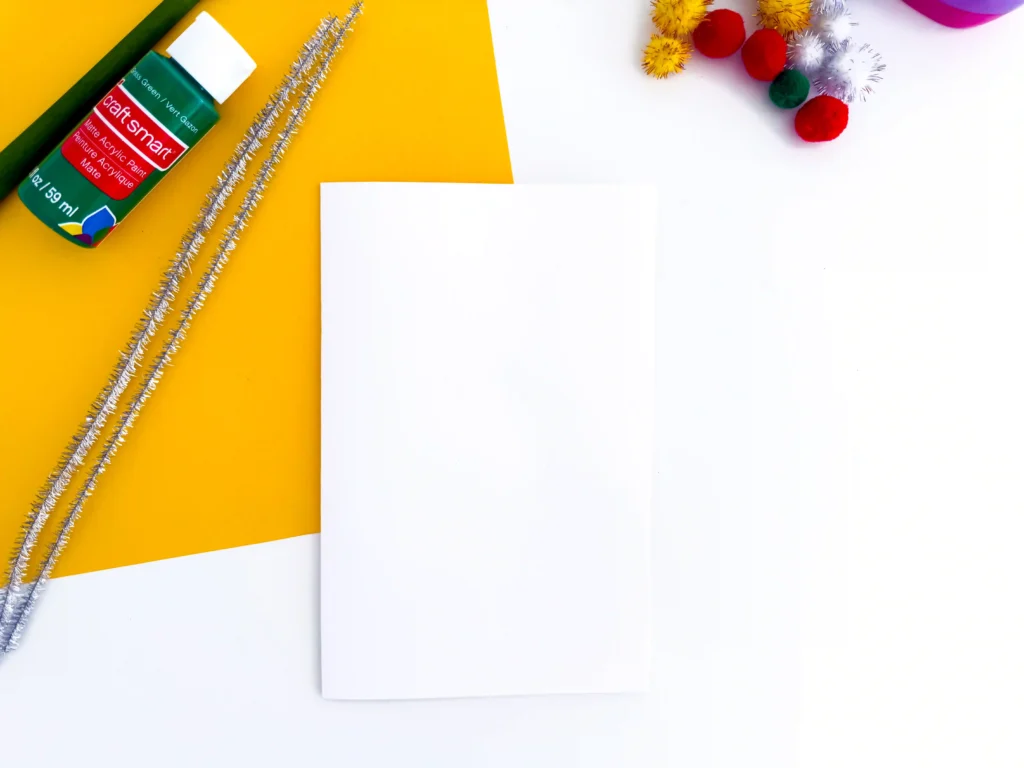 white paper folded in half to make a card
