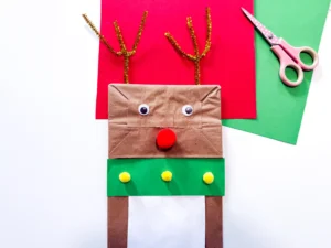 a brown paper bag decorated to look like a reindeer