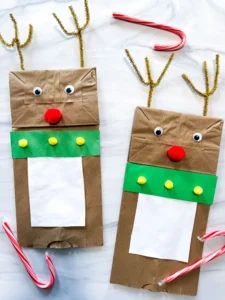 a brown paper bag decorated to look like a reindeer