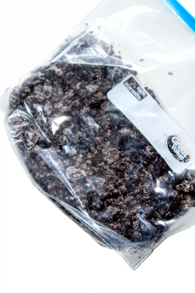 Clear plastic bag containing crushed oreos