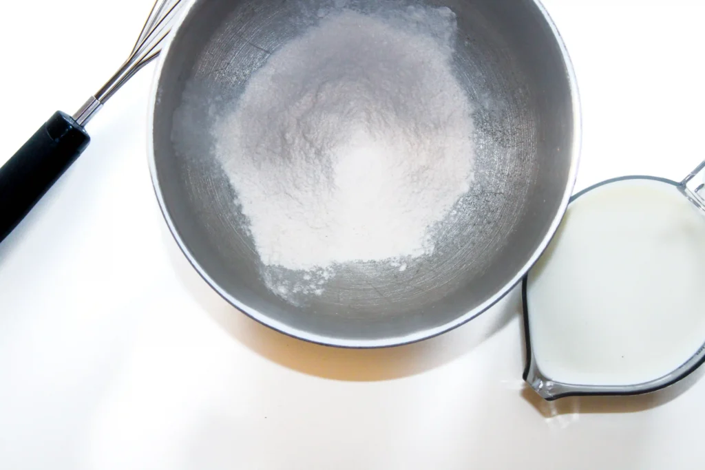 a metal bowl with instant pudding mix in it