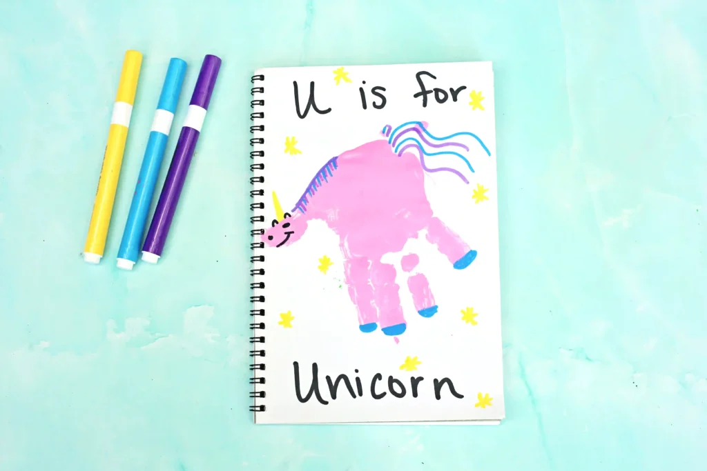 a Letter U Handprint Craft of a unicorn that reads "U is for unicorn"