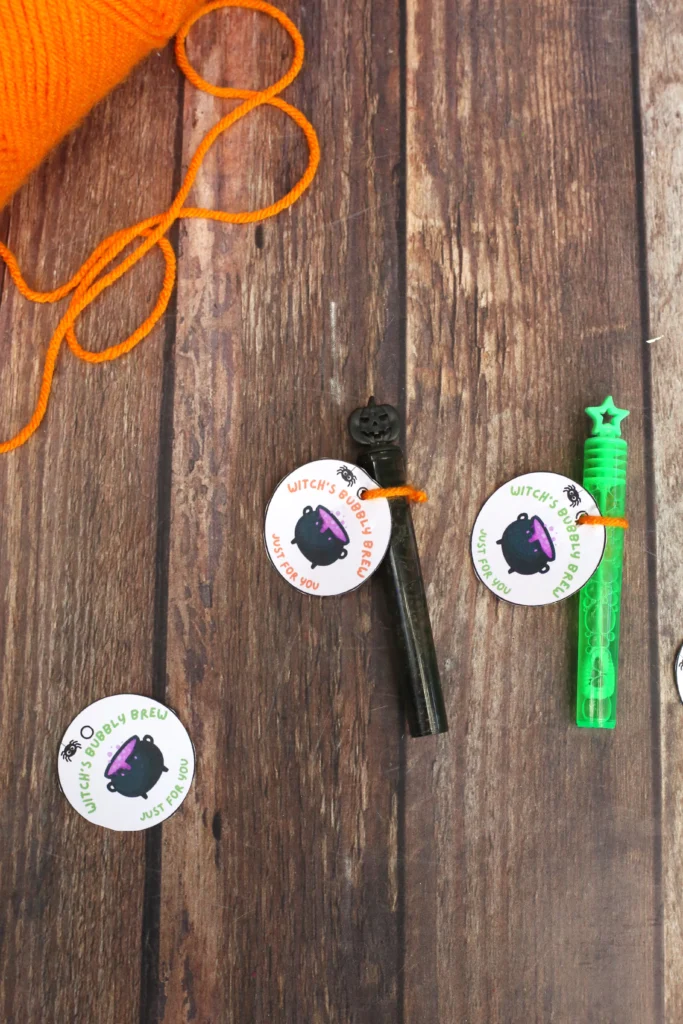 bubble wands with a tag that reads "witch's bubbly brew just for you"