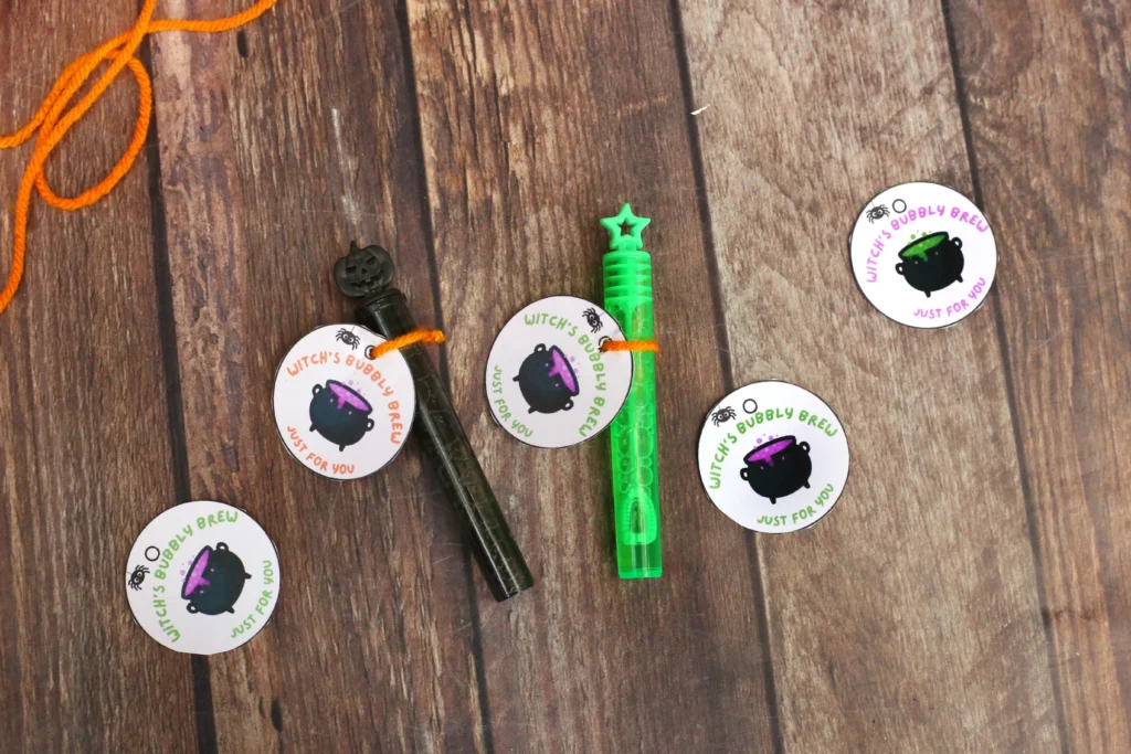 bubble wands with a tag that reads "witch's bubbly brew just for you"