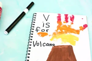 a Letter V Handprint Craft of a volcano and the handprint is the lava