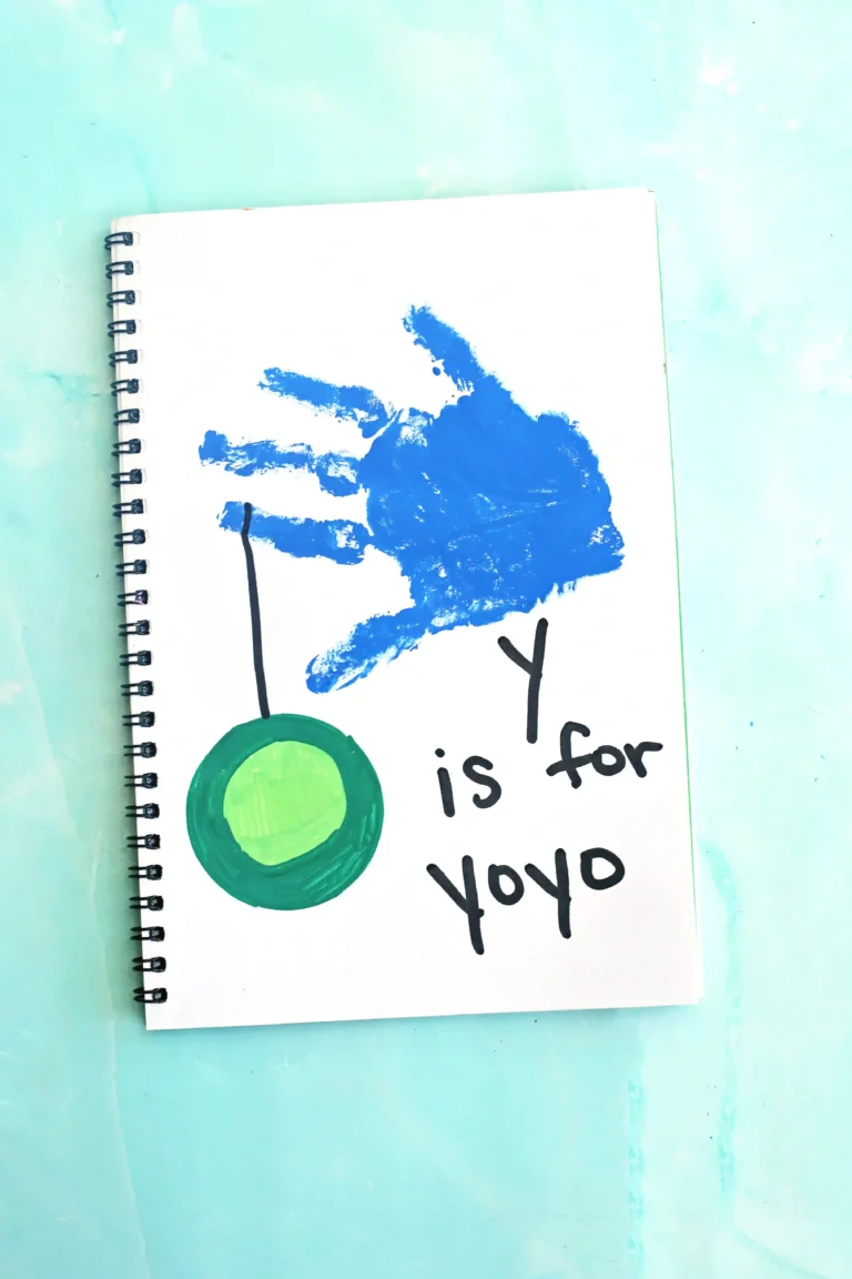 a blue handprint with a yoyo and words that read "y is for yo yo"