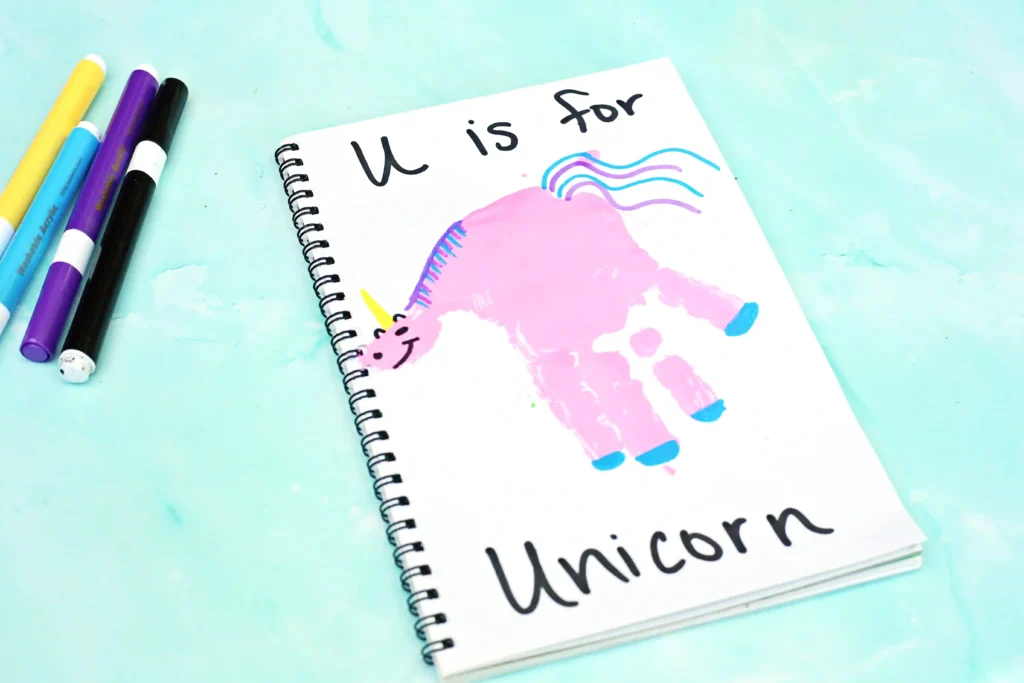 a Letter U Handprint Craft of a unicorn that reads "U is for unicorn"