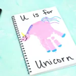 a Letter U Handprint Craft of a unicorn that reads "U is for unicorn"
