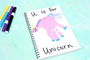 a Letter U Handprint Craft of a unicorn that reads "U is for unicorn"